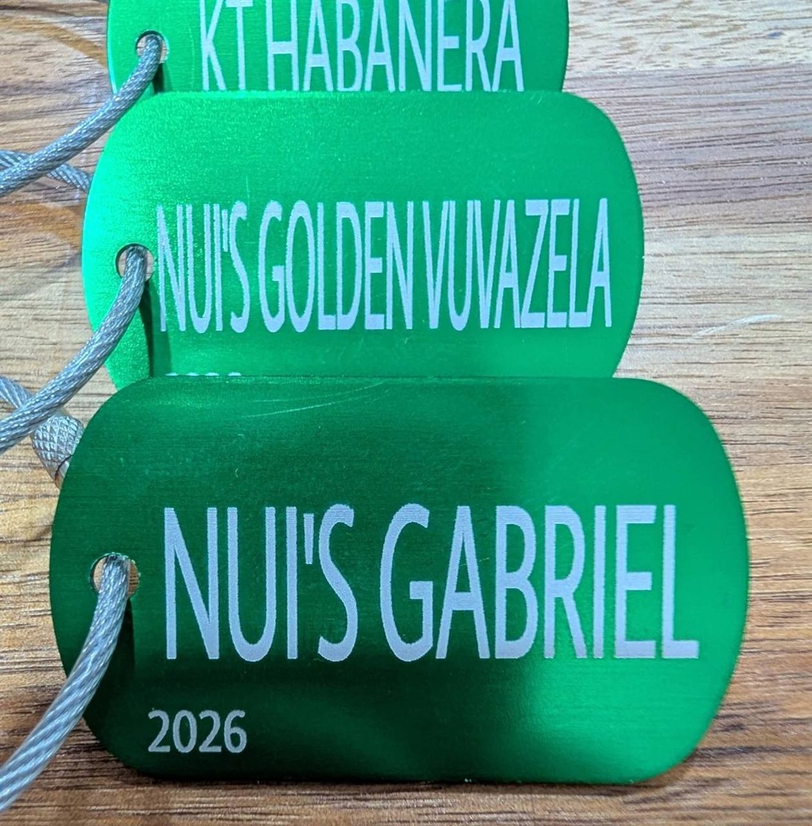Close-up of green BrockMark engraved plant tags